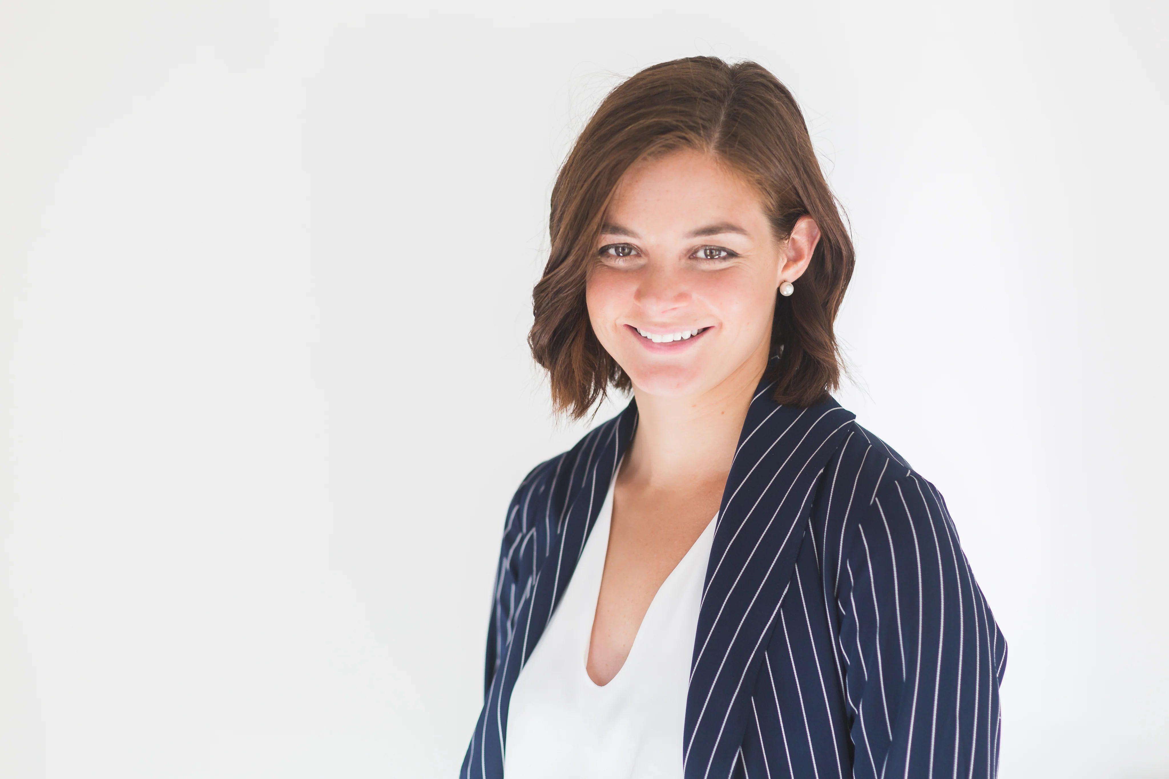 business-woman-smiling-in-office.webp